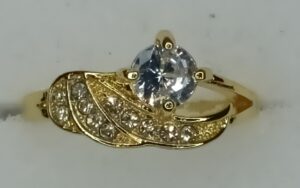 Pretty Gold Coloured Ring With Diamond Effect Stone