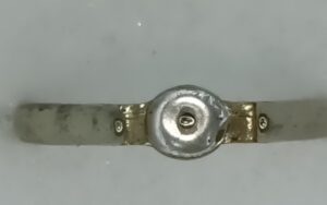 A Dantey Gold Coloured Ring with White Stone