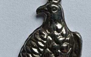 Bird Holding Skull on Chain Necklace